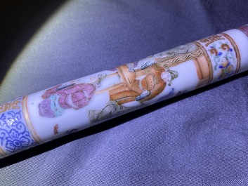 A Chinese famille rose opium pipe with silk pouch, 19th C.