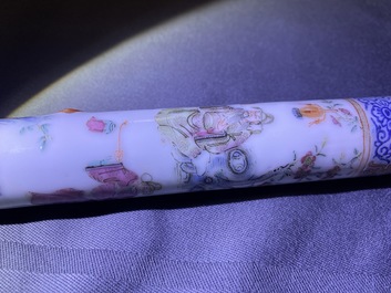 A Chinese famille rose opium pipe with silk pouch, 19th C.