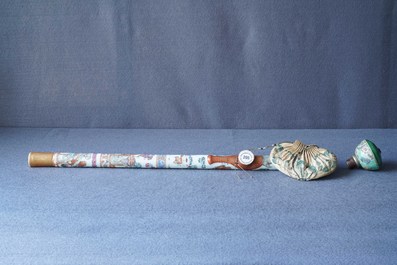 A Chinese famille rose opium pipe with silk pouch, 19th C.