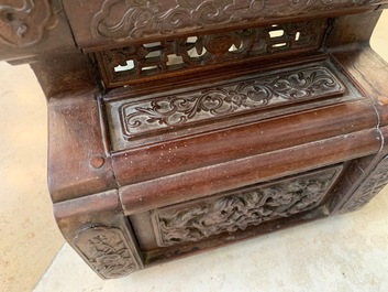 A Chinese finely carved wooden display stand, 19th C.