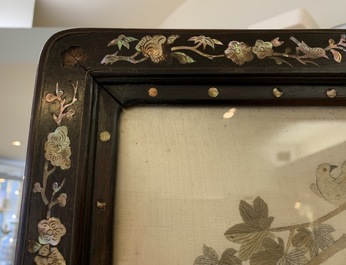 A large Chinese mother-of-pearl-inlaid wooden screen with silk embroidery, 19th C.