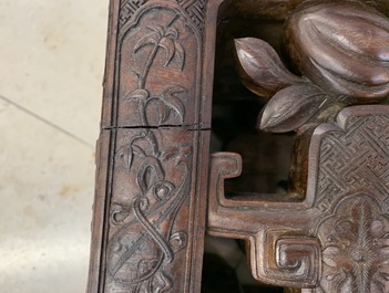 A Chinese finely carved wooden display stand, 19th C.