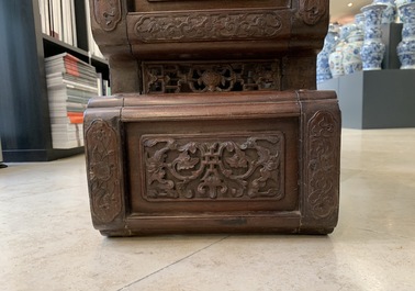 A Chinese finely carved wooden display stand, 19th C.