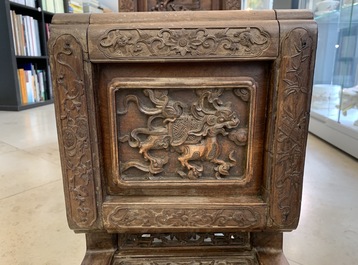 A Chinese finely carved wooden display stand, 19th C.