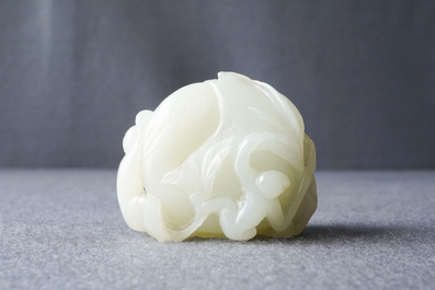 A Chinese celadon jade carving of two monkeys on a peach, 19th C.