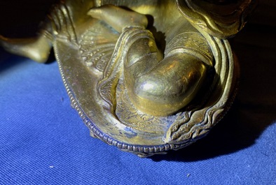 A Sino-Tibetan coral- and turquoise-inlaid gilt bronze figure of Tara, 18th C.
