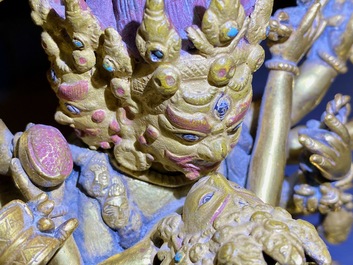 A Sino-Tibetan gilt bronze group of Mahakala and his consort Yab-Yum, 19th C.
