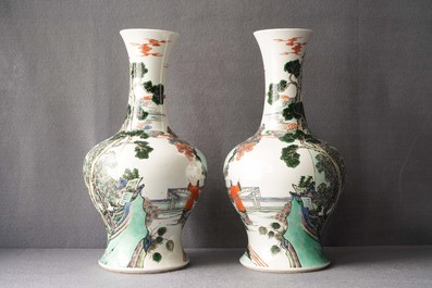 A pair of Chinese famille verte vases with figures on a terrace, Kangxi mark, 19th C.