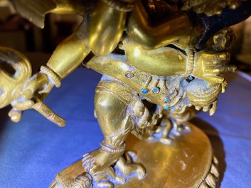 A Sino-Tibetan gilt bronze group of Mahakala and his consort Yab-Yum, 19th C.