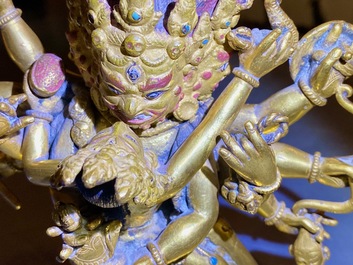 A Sino-Tibetan gilt bronze group of Mahakala and his consort Yab-Yum, 19th C.