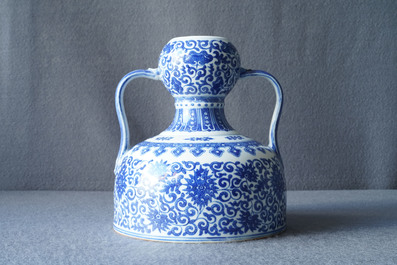 A Chinese blue and white two-handled 'lotus scroll' jug, Qianlong mark, 19/20th C.