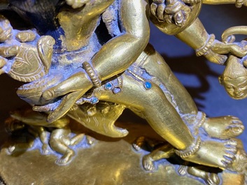 A Sino-Tibetan gilt bronze group of Mahakala and his consort Yab-Yum, 19th C.