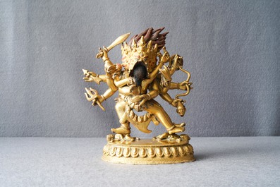 A Sino-Tibetan gilt bronze group of Mahakala and his consort Yab-Yum, 19th C.