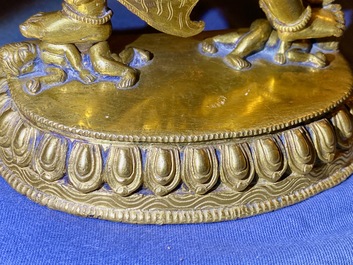 A Sino-Tibetan gilt bronze group of Mahakala and his consort Yab-Yum, 19th C.