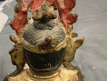 A Sino-Tibetan gilt bronze figure of Buddha, Ming