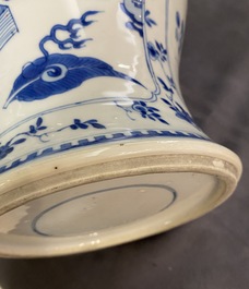 A Chinese blue and white vase with precious objects and floral designs, Kangxi
