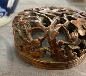 A Chinese blue and white ginger jar with figures in a landscape and a wooden cover, Transitional period