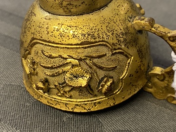 A Chinese relief-decorated gilt bronze cup, Ming