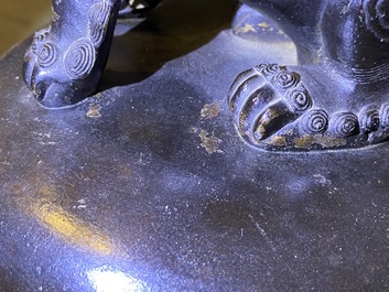 A large Chinese bronze incense burner and cover on carved wooden stand, Ming