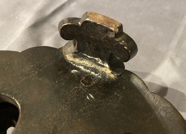 A large Chinese bronze incense burner and cover on carved wooden stand, Ming