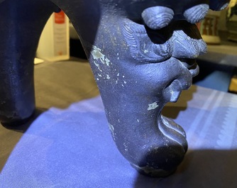 A large Chinese bronze incense burner and cover on carved wooden stand, Ming