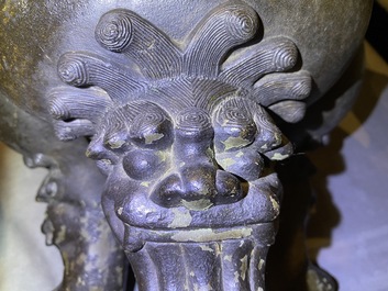 A large Chinese bronze incense burner and cover on carved wooden stand, Ming