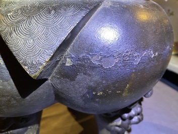 A large Chinese bronze incense burner and cover on carved wooden stand, Ming