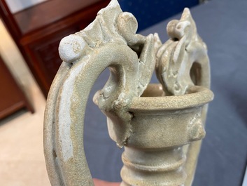 A Chinese cream-glazed stoneware amphora with dragon handles, Sui/Tang