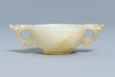 A Chinese pale celadon and russet jade two-handled bowl, prob. Ming