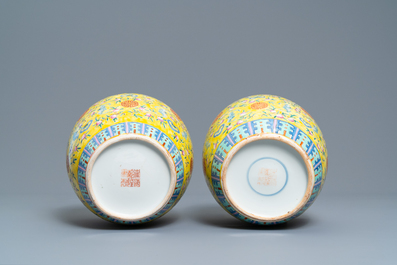 A pair of Chinese yellow-ground famille rose 'bats and shou' jars, Qianlong mark, 19th C.