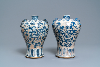 A pair of Chinese blue, white and copper-red meiping crackle-glazed vases, 19th C.