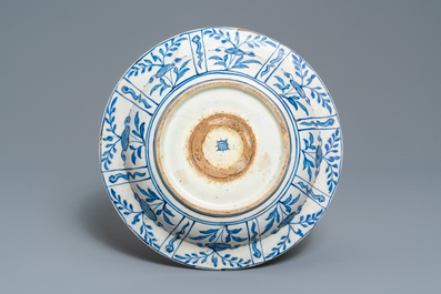 A Safavid parcel-gilt blue and white dish, Persia, 17th C.