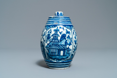 A Dutch Delft blue and white barrel-shaped gin flask with chinoiserie design, dated 1711