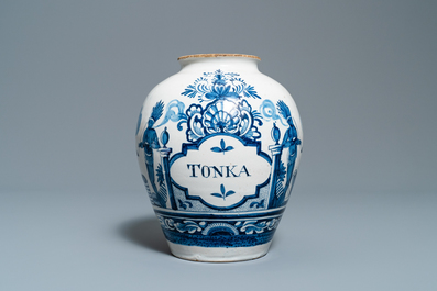 A Dutch Delft blue and white tobacco jar with American Indians and inscribed 'Tonka', 18th C.