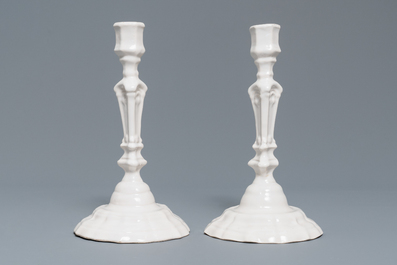 A pair of white Delftware candlesticks, 18th C.