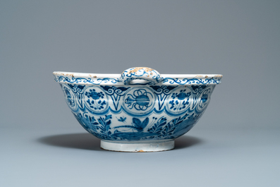 A large Dutch Delft blue and white two-handled chinoiserie bowl, 18th C.