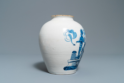 A Dutch Delft blue and white tobacco jar with American Indians and inscribed 'Tonka', 18th C.