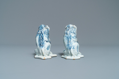 A pair of Dutch Delft blue and white models of lions, 18th C.