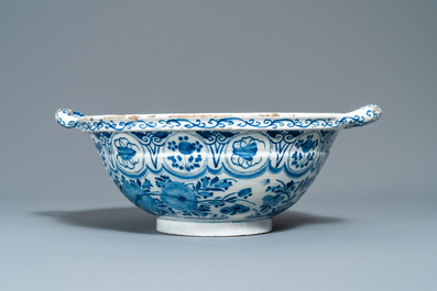 A large Dutch Delft blue and white two-handled chinoiserie bowl, 18th C.