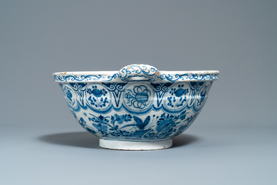 A large Dutch Delft blue and white two-handled chinoiserie bowl, 18th C.