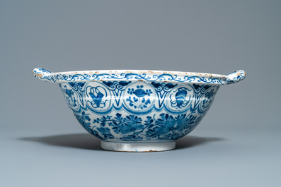 A large Dutch Delft blue and white two-handled chinoiserie bowl, 18th C.