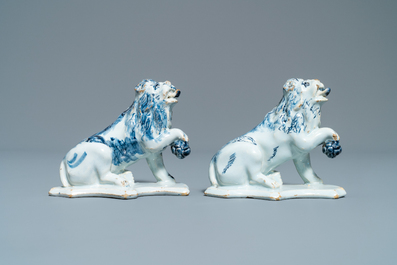 A pair of Dutch Delft blue and white models of lions, 18th C.