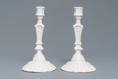 A pair of white Delftware candlesticks, 18th C.