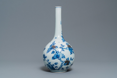 A Chinese blue, white and copper-red 'peaches' bottle vase with inscription, Kangxi
