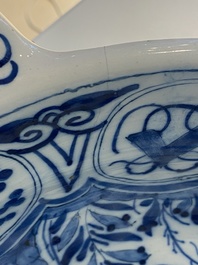 A large Dutch Delft blue and white two-handled chinoiserie bowl, 18th C.