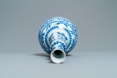 A Chinese blue and white bottle vase with figural medallions, Transitional period