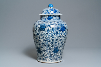 A large Chinese blue and white 'peony scrolls' vase and cover, Kangxi