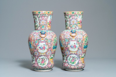 A pair of Chinese Canton famille rose pink-ground vases, 19th C.