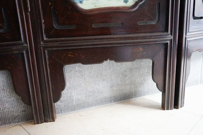 A Chinese wooden room divider with famille rose 'Romance of the Western Chamber' plaques, Republic