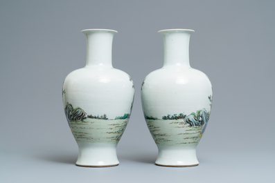 A pair of Chinese famille rose vases with go-players, Qianlong mark, 19/20th C.